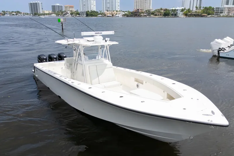 Slide: The Image of 2015 SeaVee 390Z boat cruising on open ocean waters. - 57