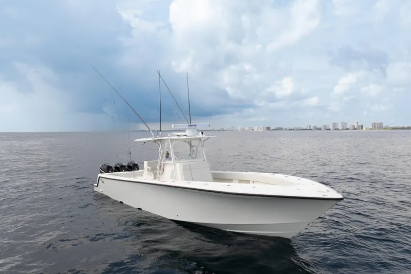 Slide: The Image of 2015 SeaVee 39Z boat cruising on water with city skyline in background. - 64