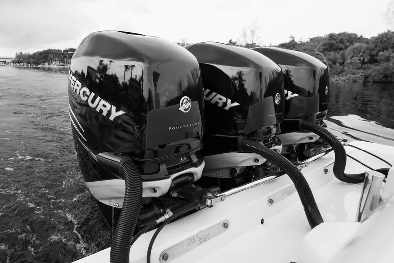 Slide: The Image of 2015 SeaVee 39Z boat cruising on open water with city skyline in background. - 72