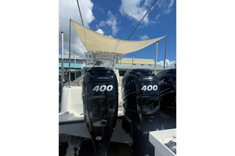 Slide: The Image of Triple Mercury outboard engines on a 2015 SeaVee 390Z boat in a scenic waterway. - 78