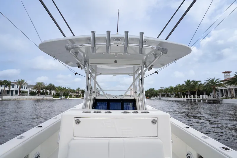Slide: The Image of 2015 SeaVee 39Z boat cruising on open water under a clear sky. - 9