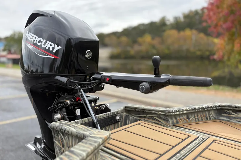 Slide: The Image of 2026 Tracker Grizzly 1650 T Prairie Wings Edition with Mercury outboard motor, autumn backdrop. - 32
