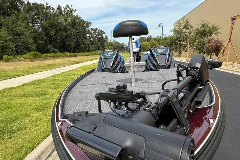 Slide: The Image of 2026 Nitro Z21 XL Pro fishing boat with advanced equipment on a sunny day. - 2