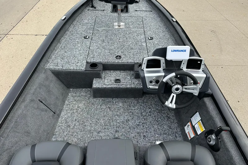 Slide: The Image of 2026 Tracker Pro Team 190 boat interior with steering wheel and Lowrance electronics. - 4