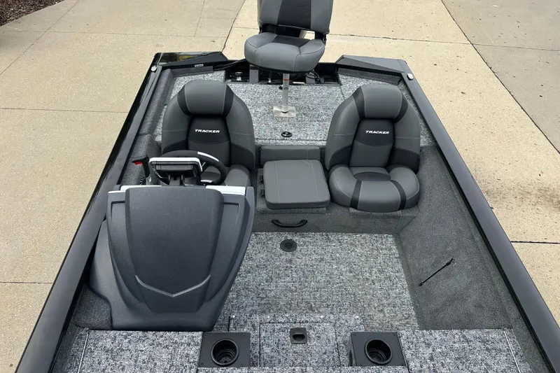 Slide: The Image of 2026 Tracker Pro Team 190 boat interior with gray seating and carpeted flooring. - 6