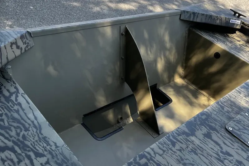 Slide: The Image of 2026 Tracker Grizzly 1648 Utility boat interior with camouflage design and storage compartments. - 8