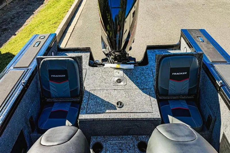Slide: The Image of 2026 Tracker Targa V-18 Combo boat interior with open storage compartment and seating. - 8