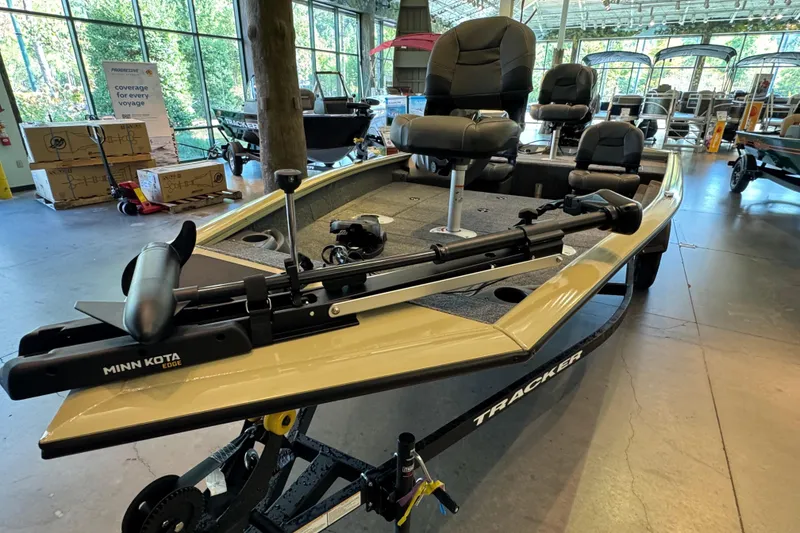 Slide: The Image of 2026 Tracker Pro Team 175 Crappie Edition boat with Minn Kota Edge motor in showroom. - 2