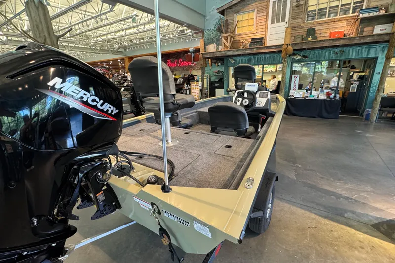 Slide: The Image of 2026 Tracker Pro Team 175 Crappie Edition boat with Mercury engine in showroom. - 3