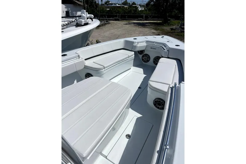 Slide: The Image of 2026 Contender 32 ST boat interior with white seating and built-in speakers. - 10