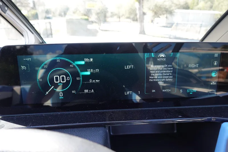 Slide: The Image of 2025 Malibu M230 dashboard display showing speed, fuel, and safety notice. - 16