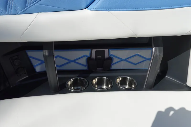 Slide: The Image of 2025 Malibu M230 interior with blue and white upholstery, featuring cup holders and stylish design. - 38