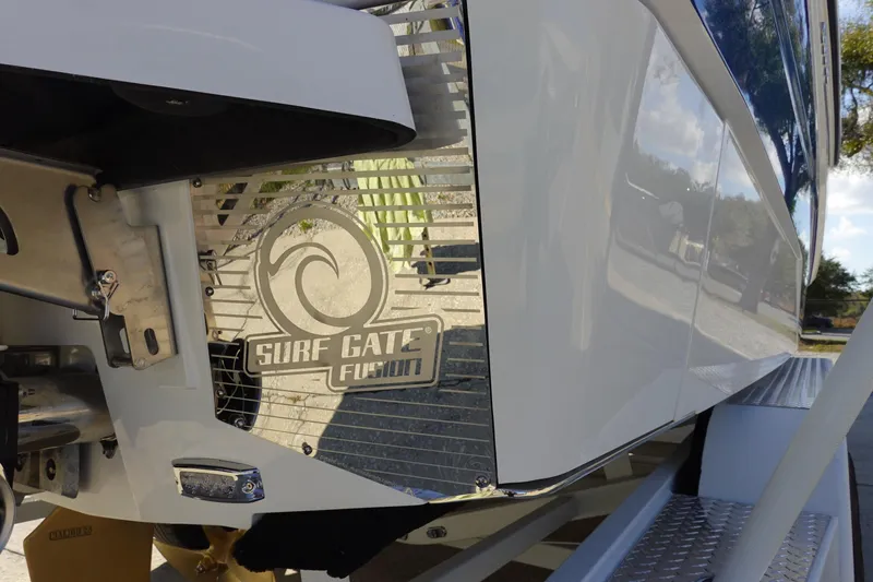 Slide: The Image of 2025 Malibu M230 boat with Surf Gate Fusion technology, rear view detail. - 48
