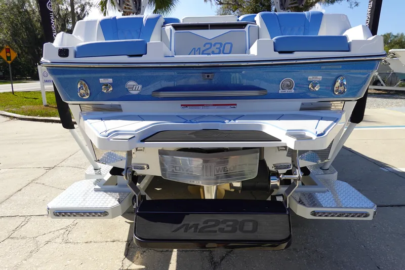 Slide: The Image of 2025 Malibu M230 boat rear view, showcasing sleek design and modern features. - 6