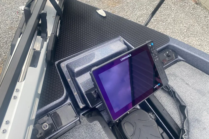 Slide: The Image of 2026 Phoenix 21 XE boat with Lowrance HDS display on deck. - 26