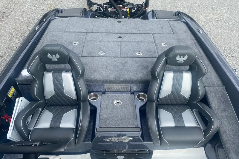 Slide: The Image of 2026 Phoenix 21 XE boat interior with dual seats and storage compartments. - 27