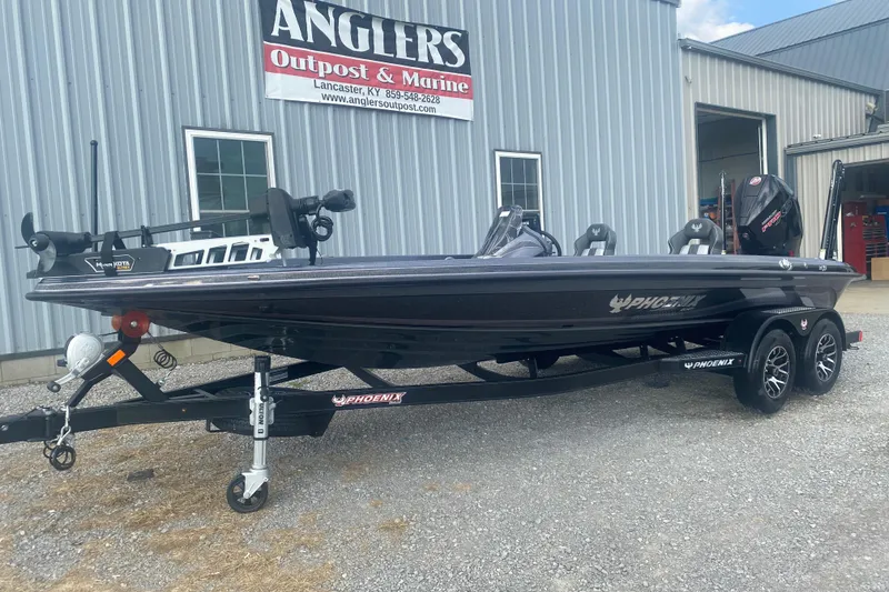 Slide: The Image of 2026 Phoenix 21 XE boat on trailer at Anglers Outpost & Marine dealership. - 3