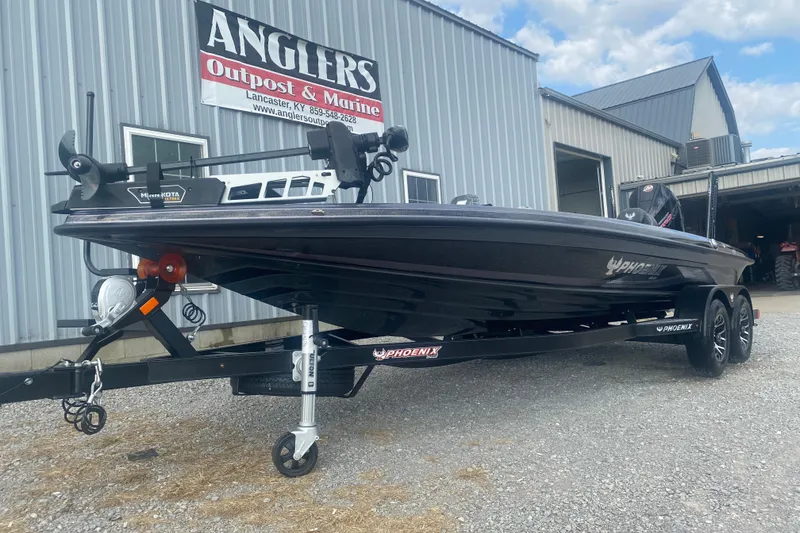 Slide: The Image of 2026 Phoenix 21 XE boat on trailer at Anglers Outpost & Marine dealership. - 4
