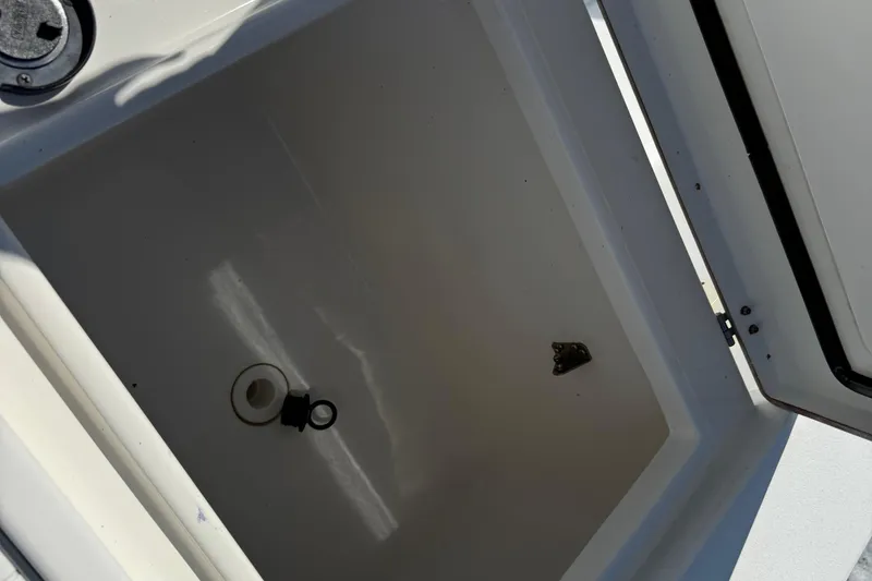 Slide: The Image of Open storage compartment on 2001 Regulator 32 Center Console boat. - 28