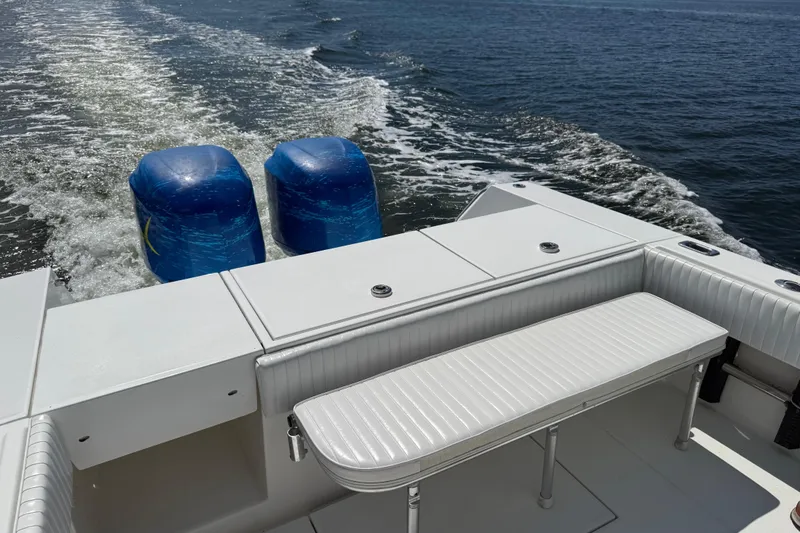 Slide: The Image of 2001 Regulator 32 Center Console boat with twin engines on open water. - 30