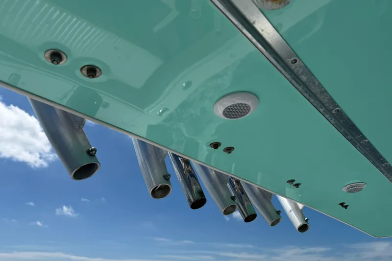 Slide: The Image of Underside view of a 2001 Regulator 32 Center Console boat against blue sky. - 31