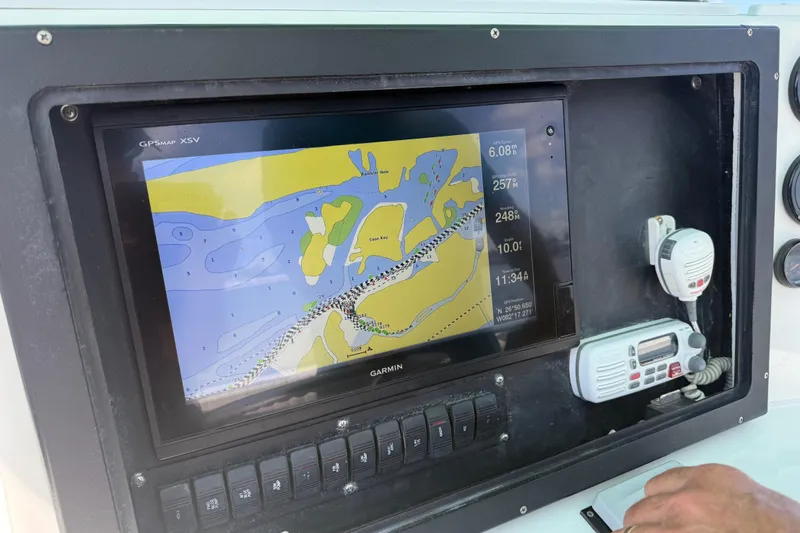 Slide: The Image of Garmin GPS display on 2001 Regulator 32 Center Console boat dashboard. - 33