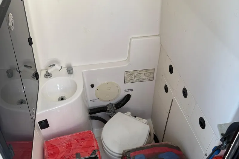 Slide: The Image of 2001 Regulator 32 Center Console boat bathroom with sink and toilet. - 40