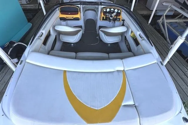 Slide: The Image of 2004 Four Winns 210 Horizon SS boat interior with white and yellow seating. - 4