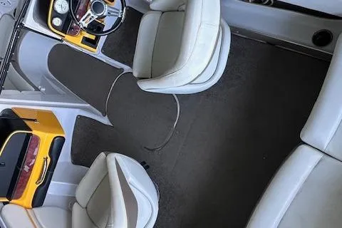 Slide: The Image of 2004 Four Winns 210 Horizon SS boat interior with white seating and dashboard. - 7