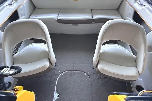 Slide: The Image of Interior of 2004 Four Winns 210 Horizon SS boat with two swivel seats. - 9