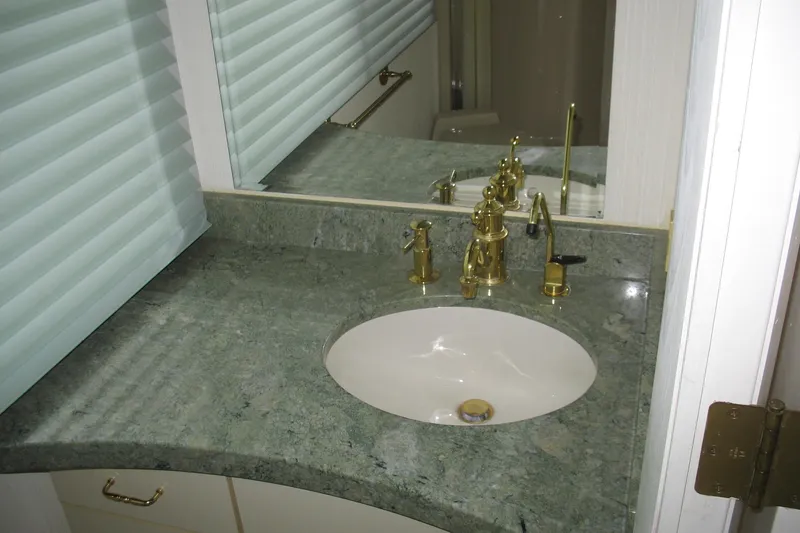Slide: The Image of Luxurious bathroom sink with gold fixtures on Skipper Liner 1993 houseboat. - 39