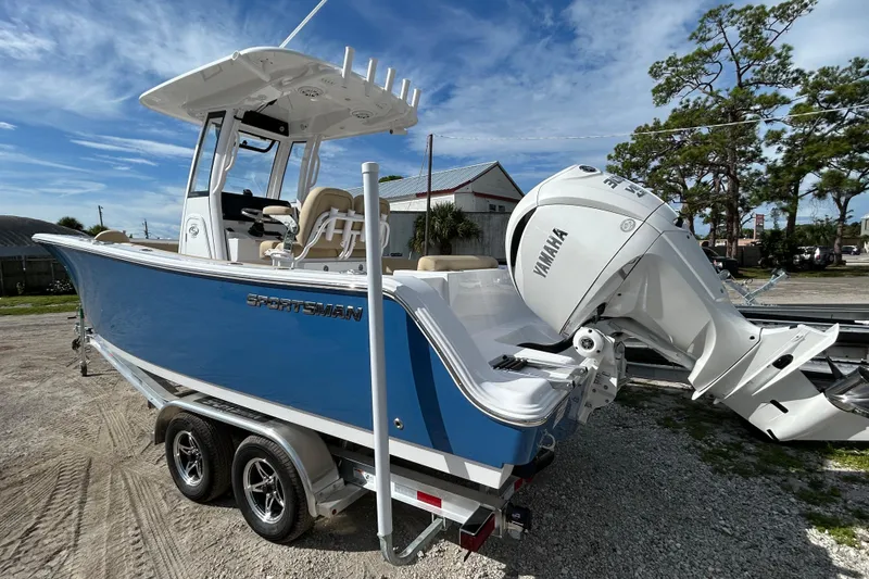 Slide: The Image of 2026 Sportsman Open 232 Center Console boat with Yamaha engine on a trailer. - 5
