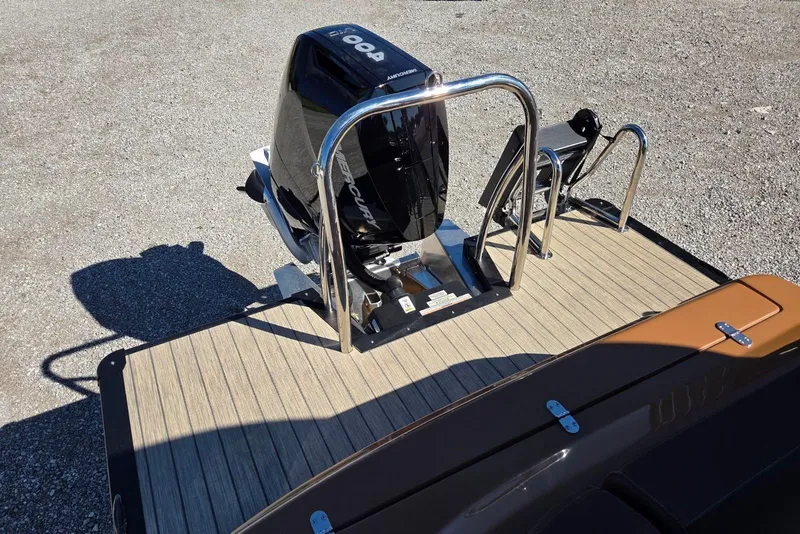 Slide: The Image of 2026 Avalon Platinum Catalina 2785 Elite boat with Mercury outboard motor on wooden deck. - 15