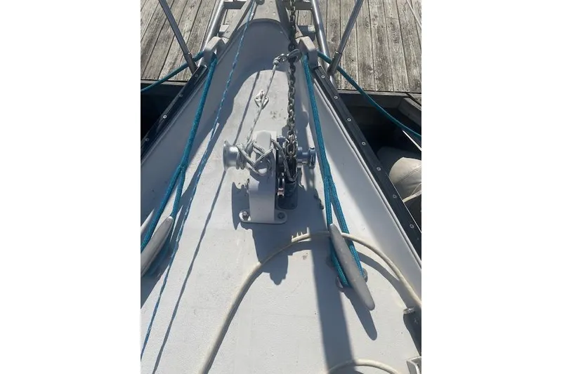 Slide: The Image of Bow of 1978 Hinterhoeller Niagara 35 Classic sailboat with anchor chain and ropes. - 13