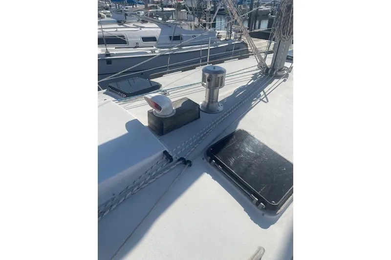 Slide: The Image of 1978 Hinterhoeller Niagara 35 Classic sailboat deck with rigging and hatches in marina. - 16