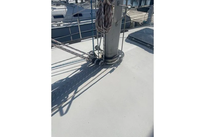 Slide: The Image of 1978 Hinterhoeller Niagara 35 Classic sailboat deck with rigging and mast details. - 17