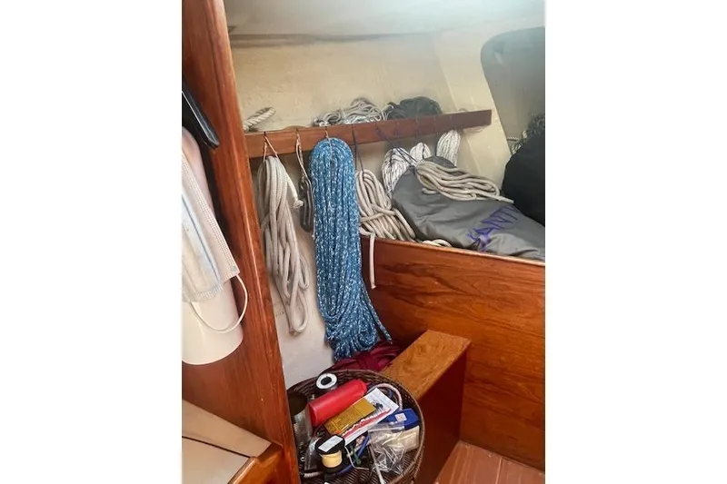 Slide: The Image of Interior of 1978 Hinterhoeller Niagara 35 Classic sailboat with ropes and supplies. - 18