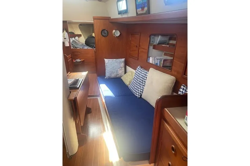 Slide: The Image of Interior of 1978 Hinterhoeller Niagara 35 Classic sailboat with cozy seating and wooden finishes. - 22