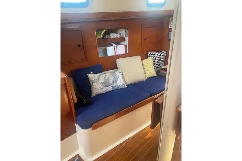 Slide: The Image of Interior of 1978 Hinterhoeller Niagara 35 Classic sailboat with cozy seating and cushions. - 23