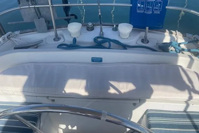 Slide: The Image of Cockpit of 1978 Hinterhoeller Niagara 35 Classic sailboat with steering wheel and seating. - 3