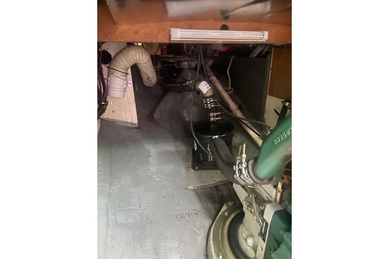 Slide: The Image of Engine compartment of 1978 Hinterhoeller Niagara 35 Classic sailboat, showing mechanical components. - 44
