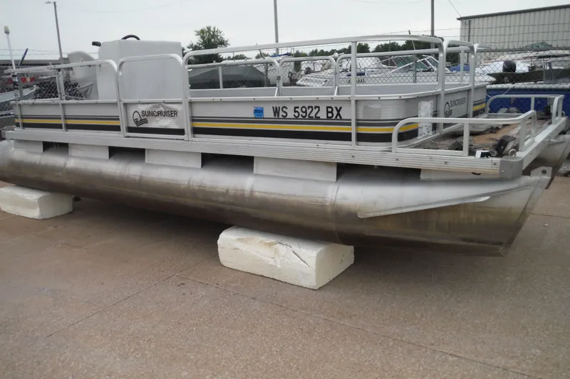 The Image of 1989 Sea Nymph SS200 SUNCRUISER pontoon boat on display, resting on blocks. - 0