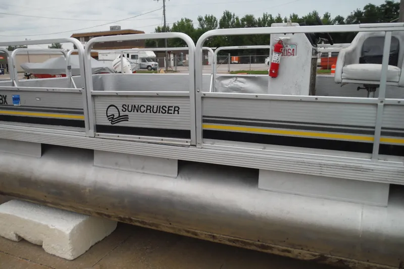 Slide: The Image of 1989 Sea Nymph SS200 SUNCRUISER pontoon boat docked on land. - 12