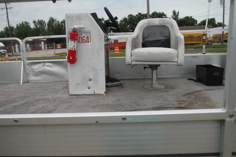 Slide: The Image of 1989 Sea Nymph SS200 SUNCRUISER interior with captain's chair and control console. - 13