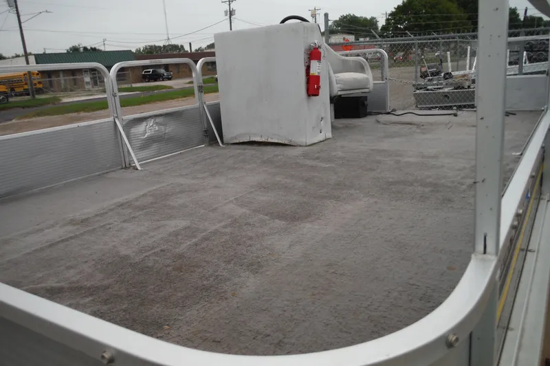 Slide: The Image of 1989 Sea Nymph SS200 SUNCRUISER pontoon boat interior with steering console and seating. - 2