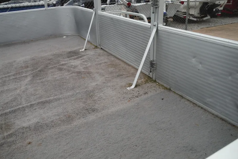 Slide: The Image of 1989 Sea Nymph SS200 SUNCRUISER deck with gray carpet and metal railing. - 3