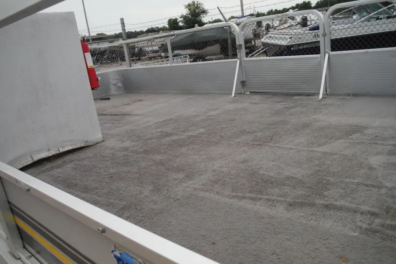 Slide: The Image of 1989 Sea Nymph SS200 Suncruiser deck with railing and fire extinguisher. - 4