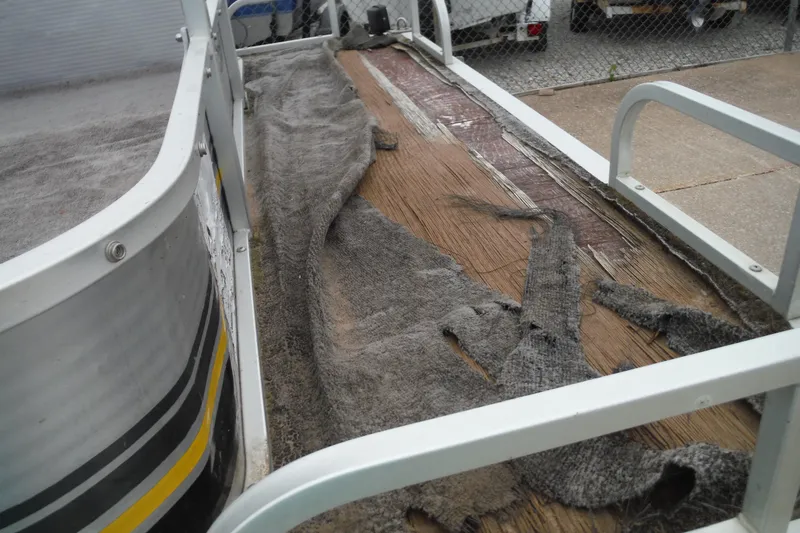 Slide: The Image of 1989 Sea Nymph SS200 Suncruiser with worn flooring and peeling carpet. - 6