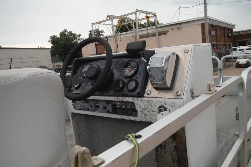 Slide: The Image of 1989 Sea Nymph SS200 SUNCRUISER boat dashboard with steering wheel and control panel. - 7