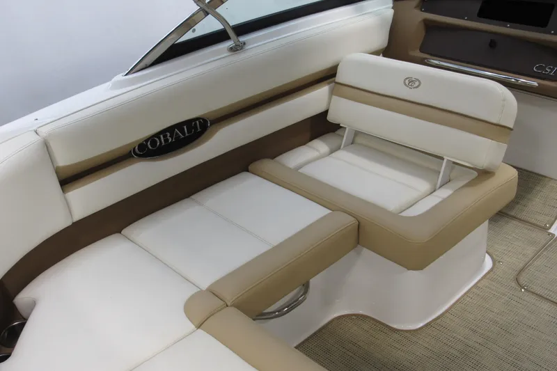 Slide: The Image of 2017 Cobalt CS1 boat interior with beige and white seating, showcasing luxury design. - 10